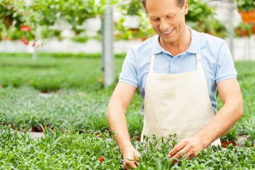 Gardener adjusting equipment to create a quieter, accessible work environment
